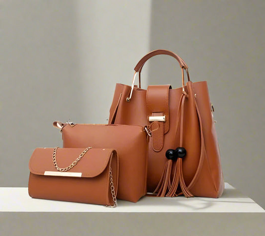 Brown handbag with matching clutch on a beige background