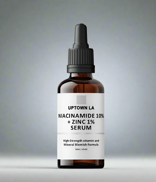Bottle of Uptown LA Niacinamide 10% + Zinc 1% Serum on a gray background