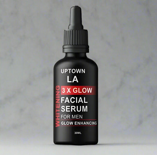 Black facial serum bottle with 'Uptown LA' branding on a white background