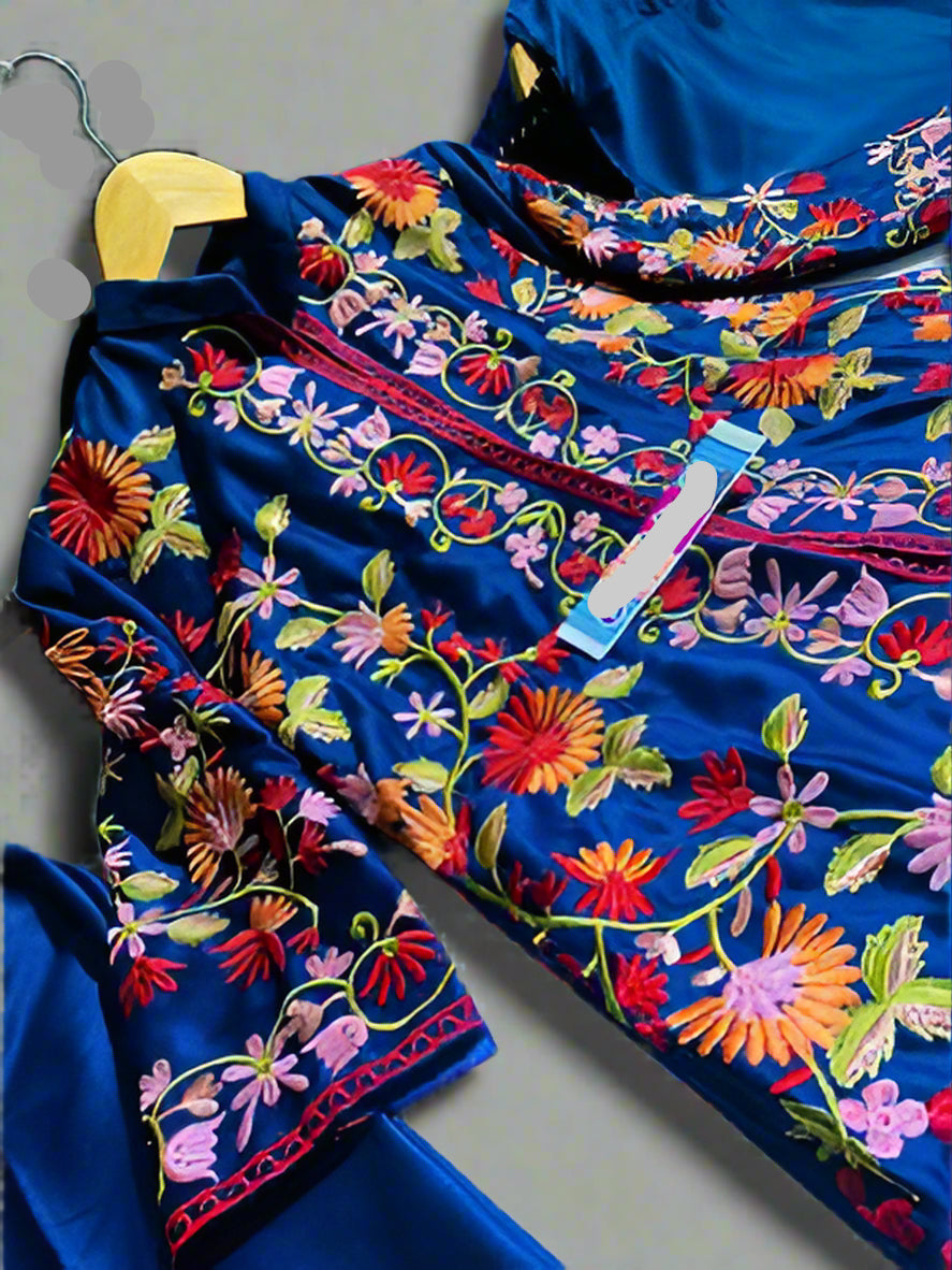 Colorful embroidered fabric on a hanger.