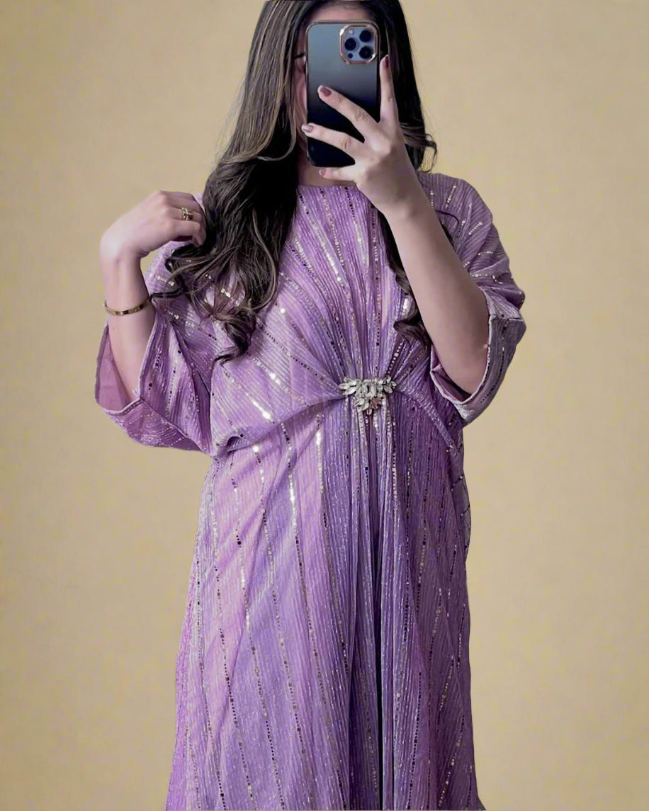 Person wearing a purple dress with a belt