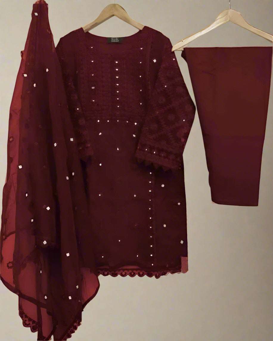 Maroon embroidered outfit with dupatta on a beige background