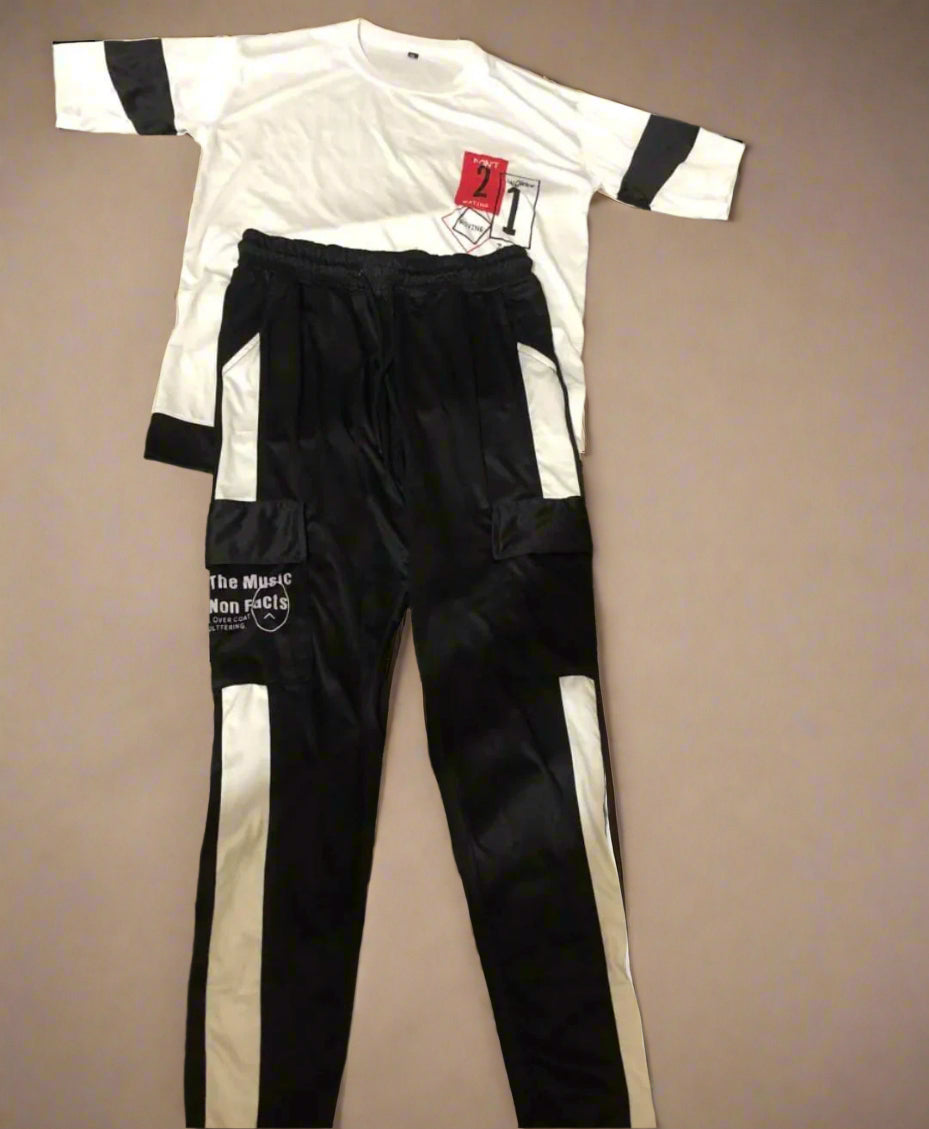 White and black sports outfit with visible branding on a beige background