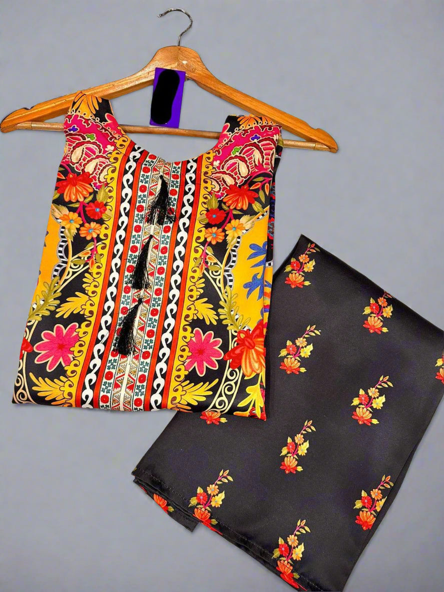 Colorful patterned top and black pants on a hanger against a tiled floor background