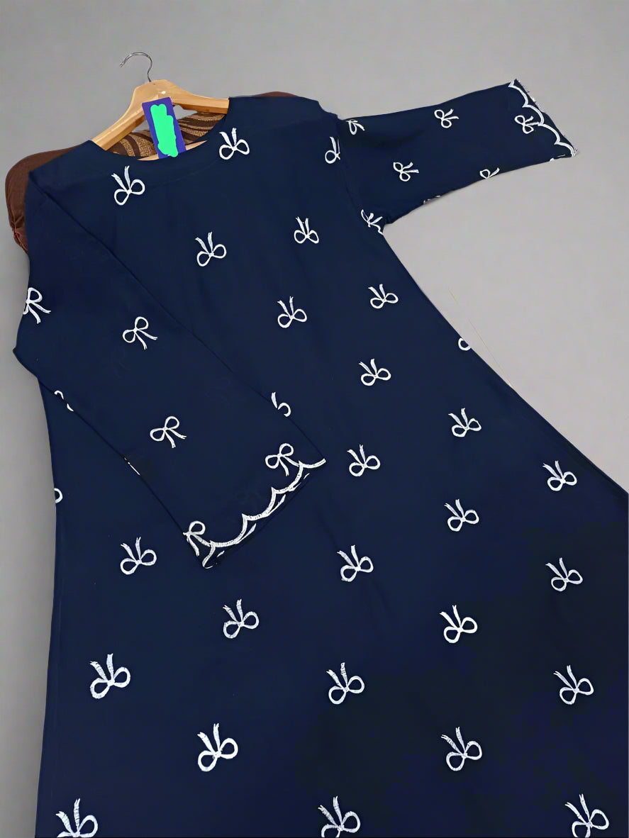 Navy blue dress with white patterns on a hanger