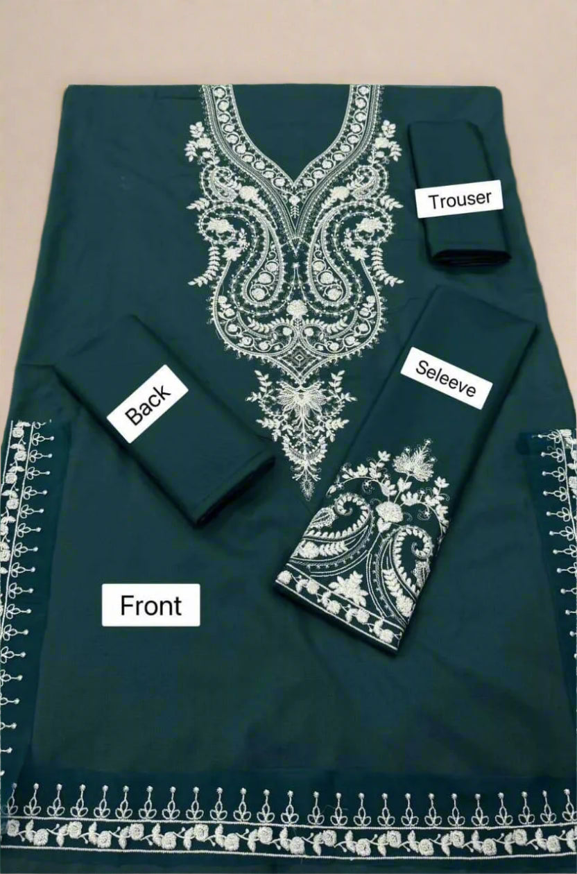 Green embroidered fabric with labeled parts on a beige background
