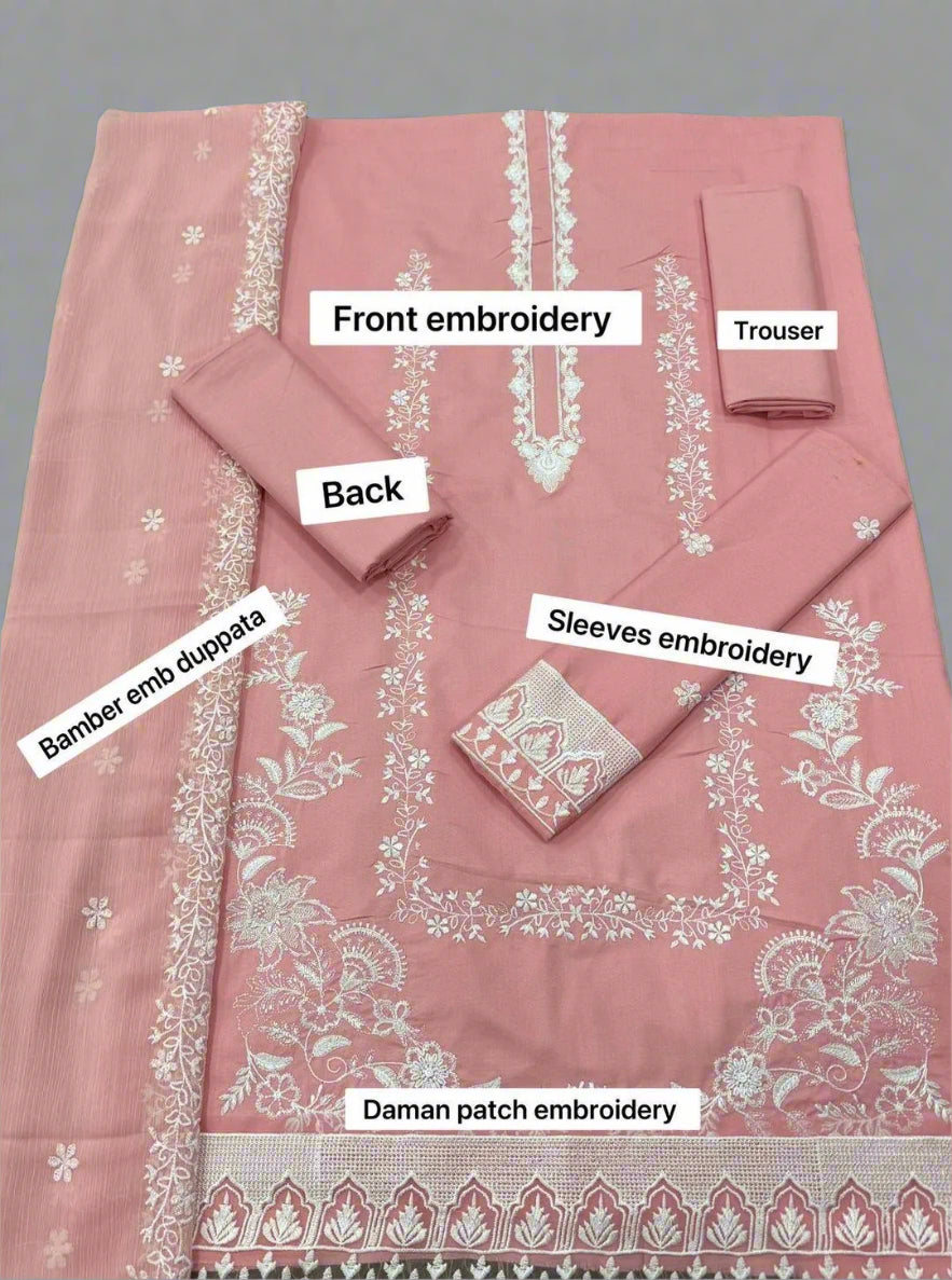 Pink embroidered outfit with labeled parts on a gray background