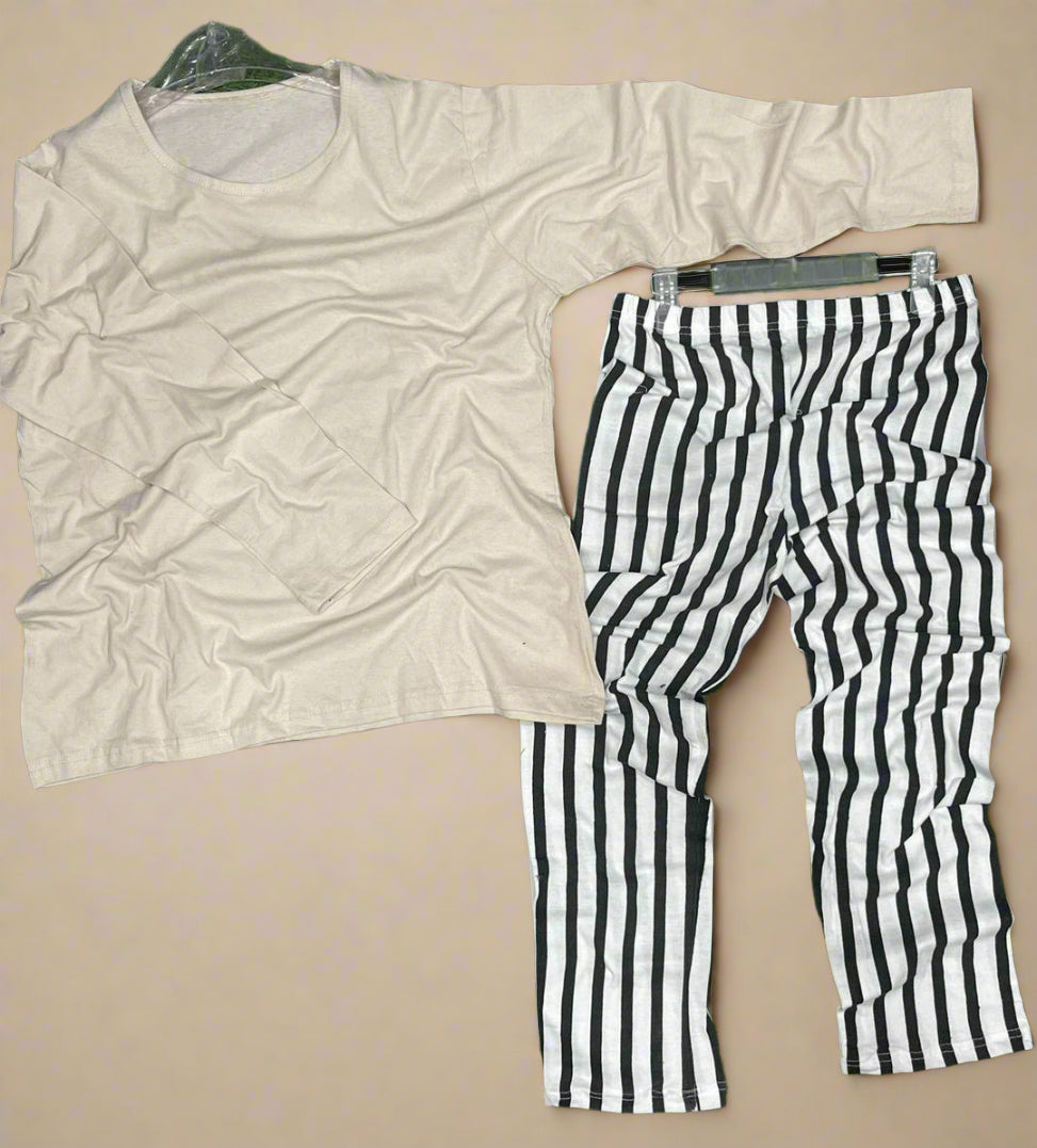 Beige shirt and black and white striped pants on a beige background
