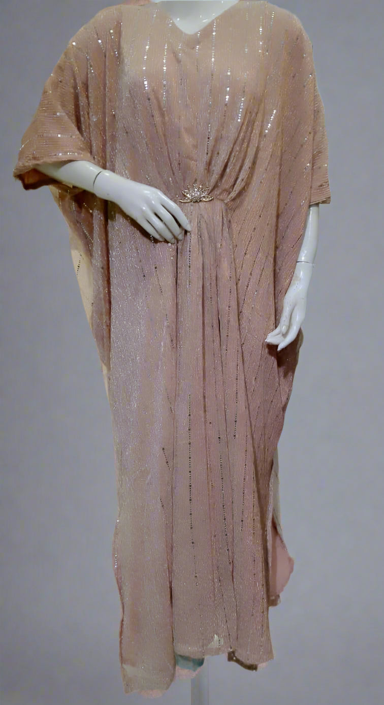 Mannequin wearing a bronze sequined dress