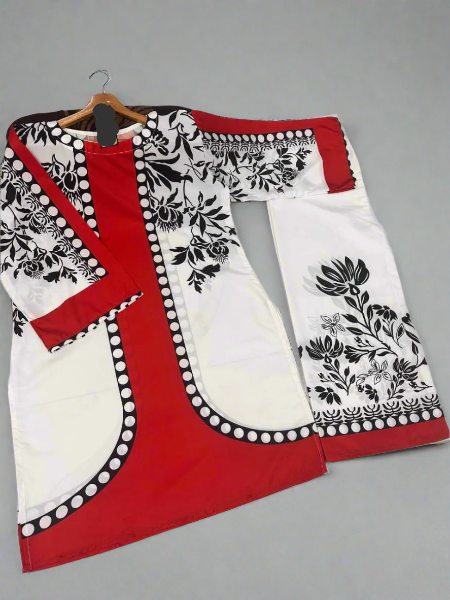 Red and white outfit with black floral patterns on a hanger.