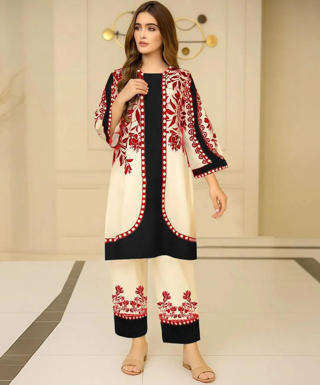 Woman wearing a traditional outfit with red and white embroidery in a minimal indoor setting.