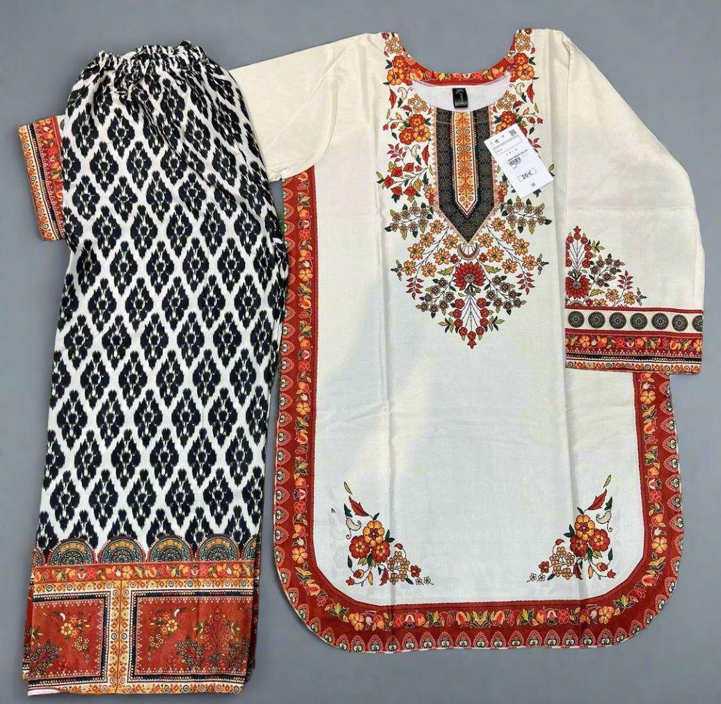 Traditional outfit with a patterned kurta and pants on a grey background