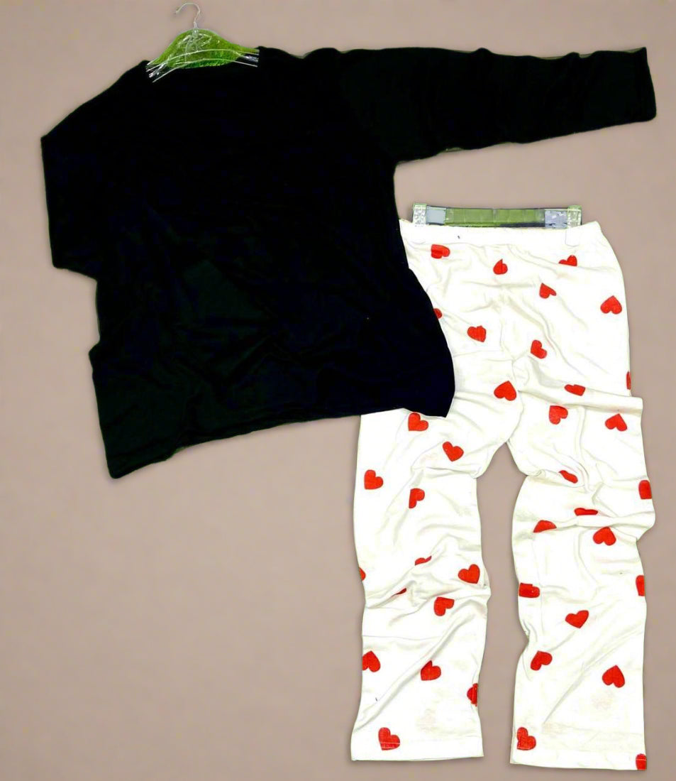 Black long-sleeve shirt and white pants with red heart patterns